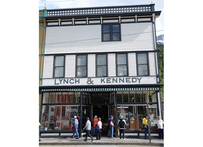 False front white building with sign "Lynch & Kennedy" False front white building with sign "Lynch & Kennedy"