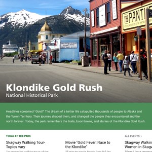 Screen shot of a scenic town picture and text "Klondike Gold Rush National Historical Park" with menu items below.