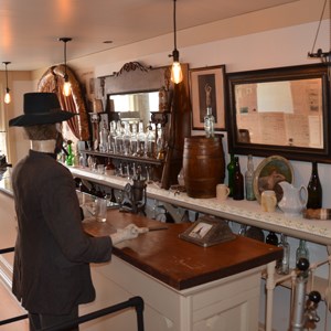 Mannikin standing at old fashioned saloon bar