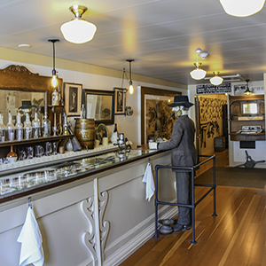 Mannequin standing at old fashioned saloon bar