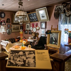 Crowded Victorian-style parlor