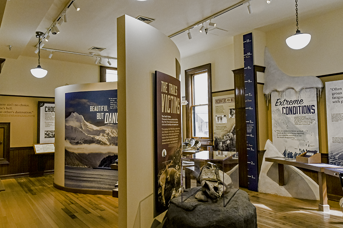 Interior shot of the exhibits within the Visitor Center Museum, with a wall in the center.
