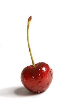 A cherry with water droplets coating the outside.