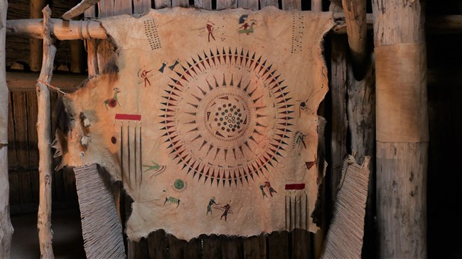 The Four Bears Exploit Robe decorated with painted images of Four Bears' exploits.