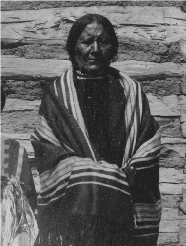 Buffalo Bird Woman wrapped in a blanket.