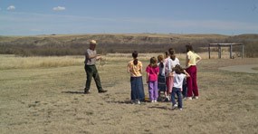Ranger leading kids in a game. Ranger leading kids in a game.