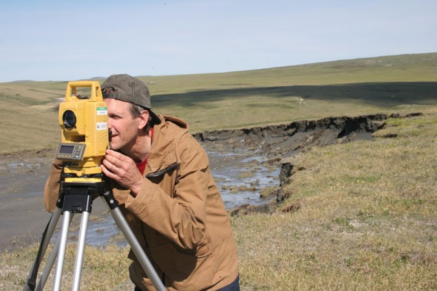 NPS ecologist Dave Swanson surveying a thaw slump