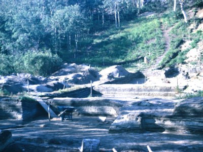 archeological dig with hill behind it