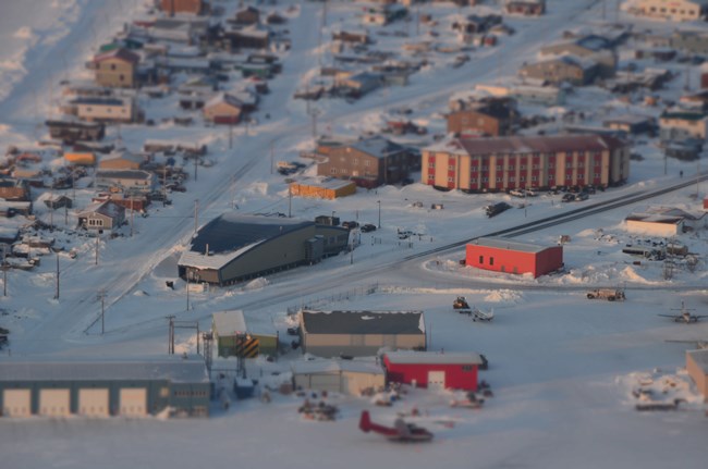 An aerial photo featuring the Northwest Arctic Heritage Center and the buildings that surround it.