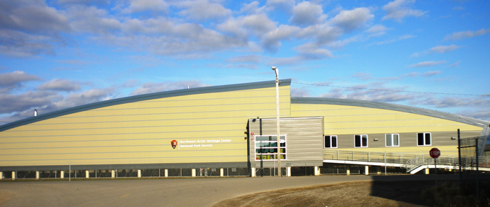 yellow building with blue sky above