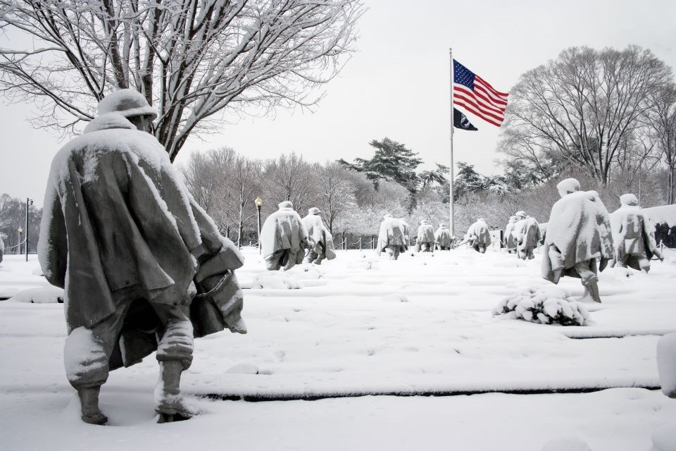 Statues at Korean War Veterans Memorial in snow