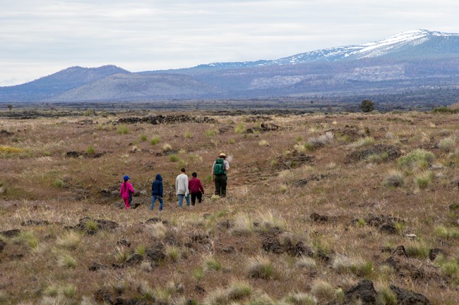 A ranger leading a group of students on a trail at Captain Jacks Stronghold.