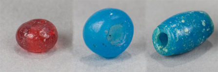 Red drawn bead, blue drawn bead, and blue ovoid wound bead.