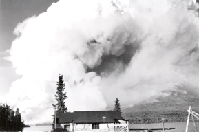 In this photo Babe and Mary Alsworth's home is shown in the foreground with the smoke from the 1953 fire billowing in the background. In this photo Babe and Mary Alsworth's home is shown in the foreground with the smoke from the 1953 fire billowing in the background.