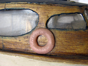 Close up view of the life preserver on wooden model boat