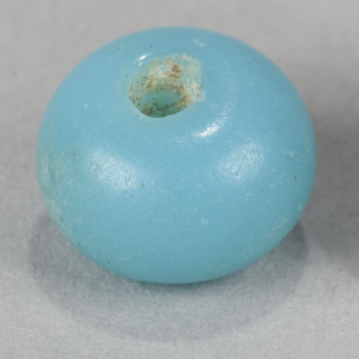 closeup of a small blue glass bead