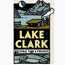 cabin by a mountain lake with smoke rising from the chimney, the words Lake Clark in bright yellow with National Park and Preserve below.