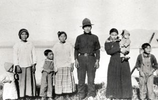 historic image of a man, woman and six children of various ages