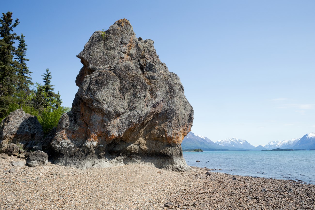 Image of rocky outcrop along shoreline of lake.