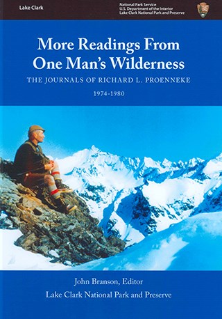 book cover showing a man sitting on rocks amid snowy mountains