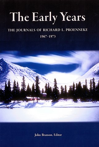 book cover showing snowy forest and mountain landscape