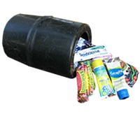 photo of a small, black, plastic barrel laying on it's side with food and toiletries spilling out of it.