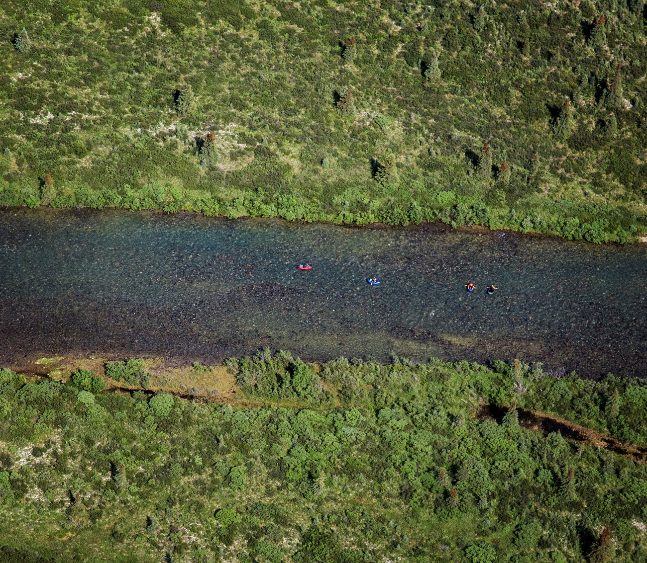 from the air, rafters in boats in a river