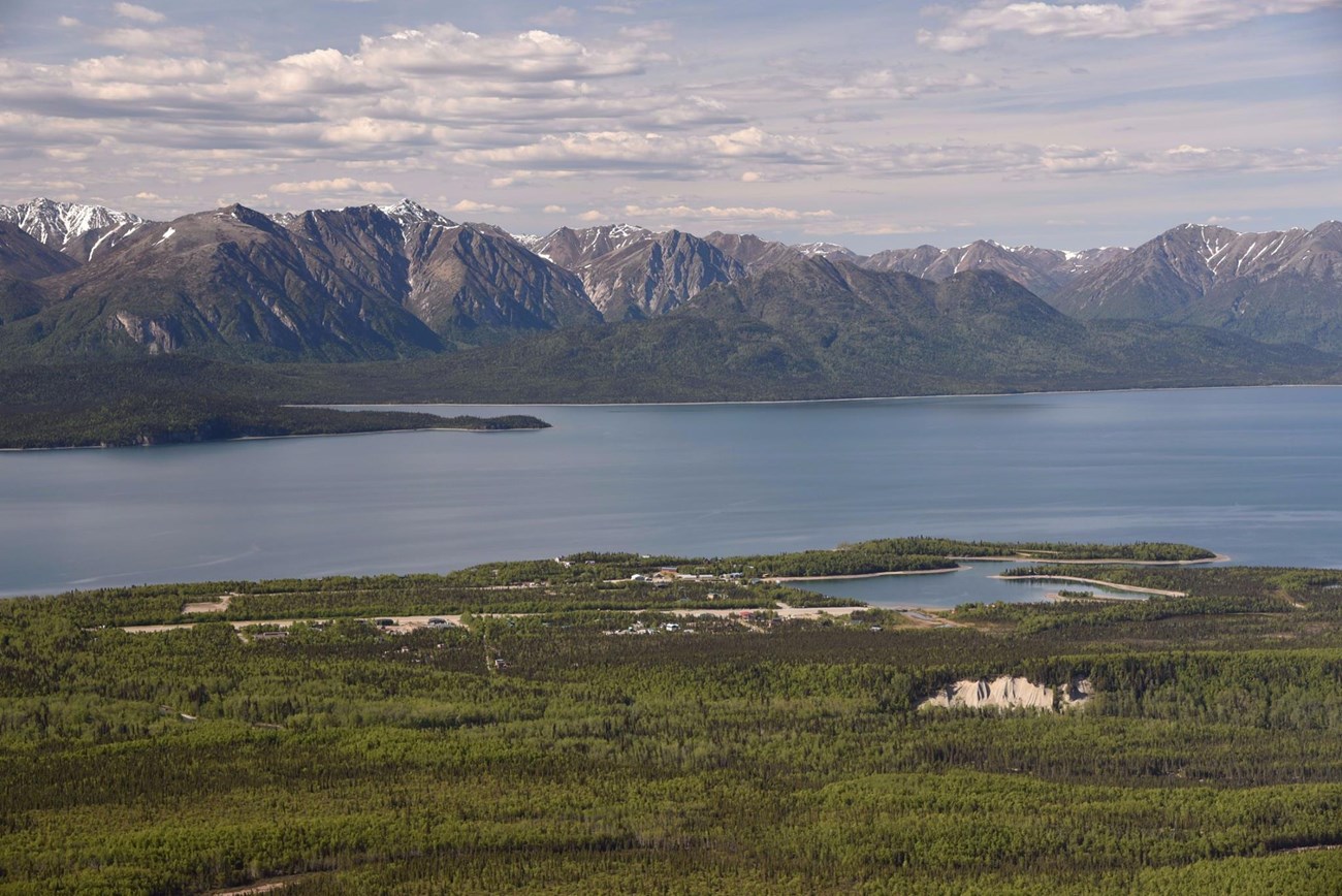 An aerial image of a Port Alsworth on the shore of Lake Clark