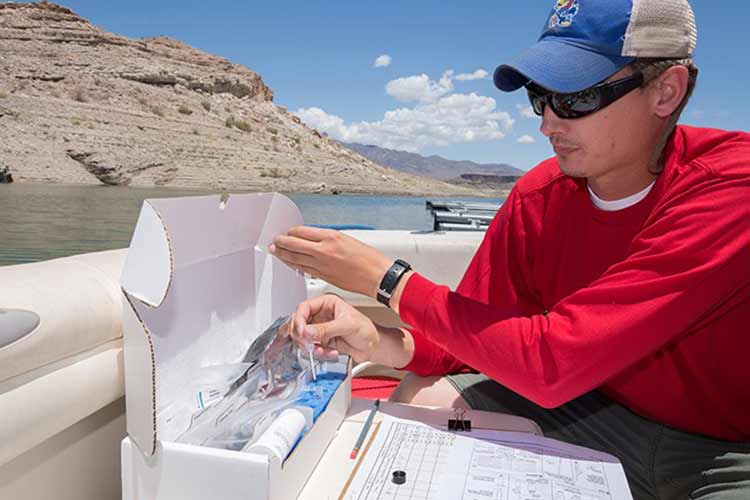 Researcher on the lake