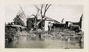 Lake water approaching the home of one of the last residents in the town.