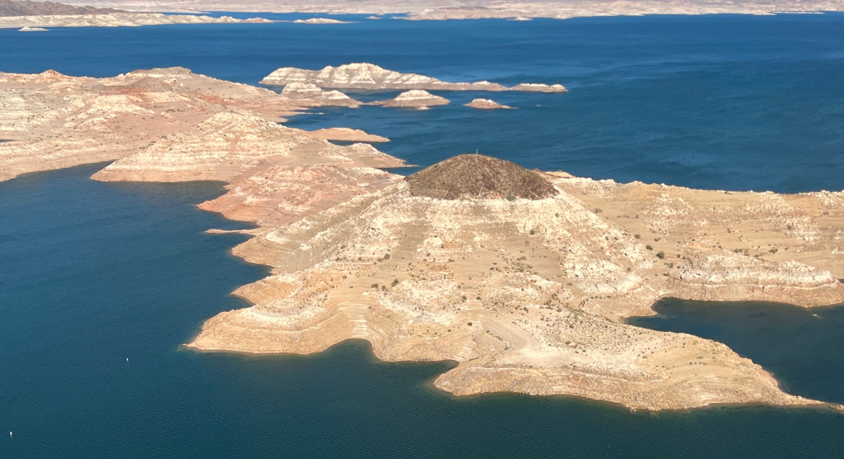 Aerial photo of Boulder Harbor Islands with calcium deposit "bathtub ring" from low water