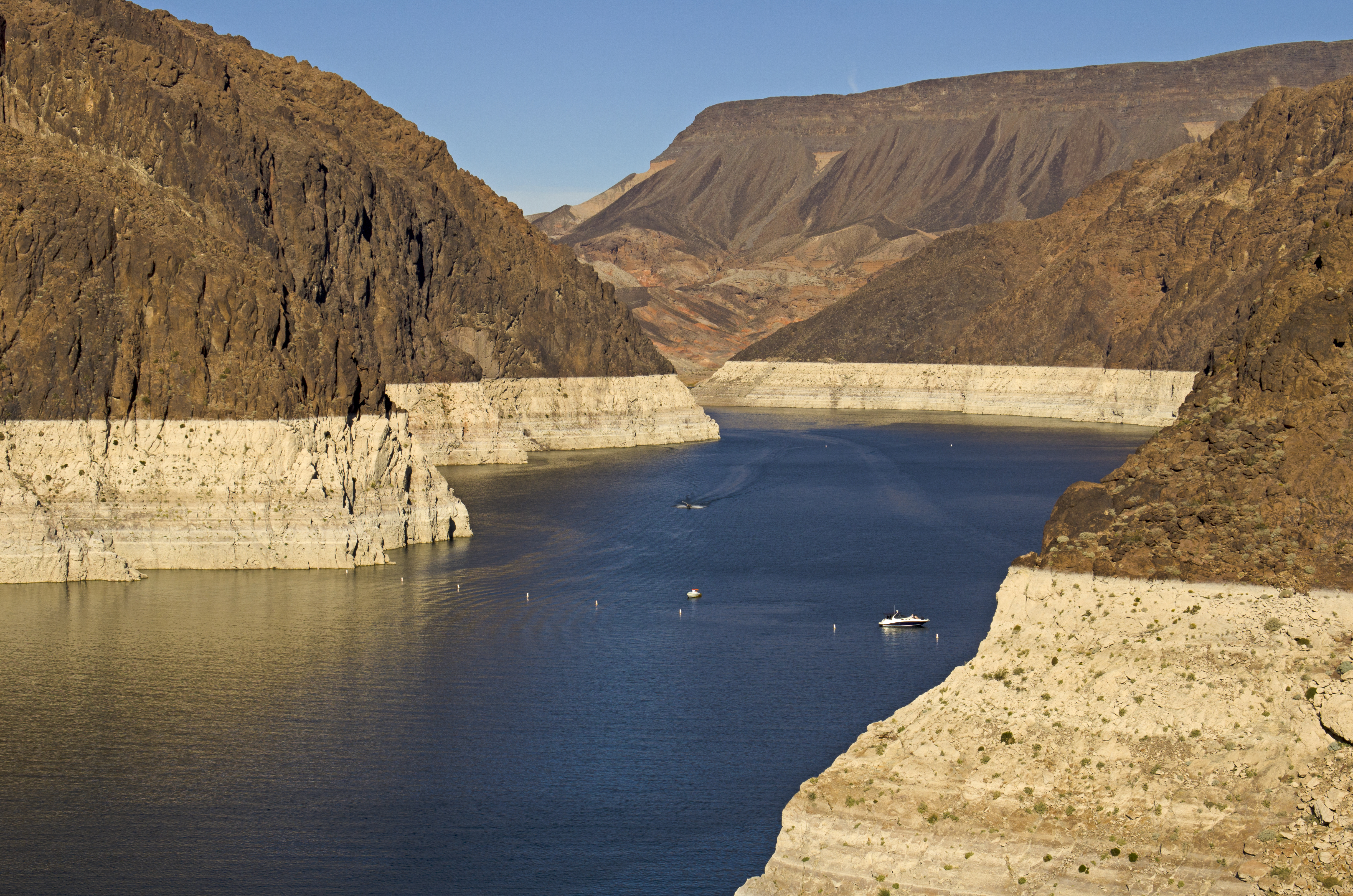 Boats on Lake Mead showing the change in color on shore due to low water