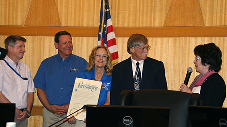 Clark County Commissioner Mary Beth Scow presents an official county proclamation to Lake Mead National Recreation Area Superintendent Bill Dickinson, Las Vegas Boat Harbor Manager Gail Kaiser, Forever Resorts Regional Vice President Rod Taylor and Deputy Superintendent Pat Gubbins May 6 to recognize the park’s 50th anniversary and National Safe Boating Week. (Photo credit: Clark County)
