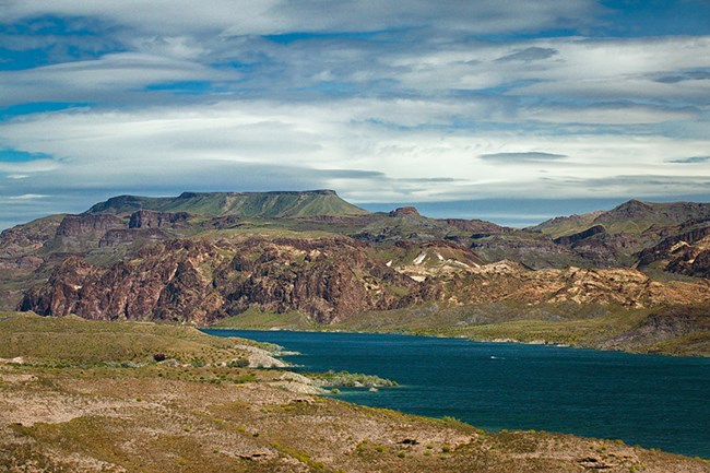 Photo of Colorado River flowing between hills and foreground