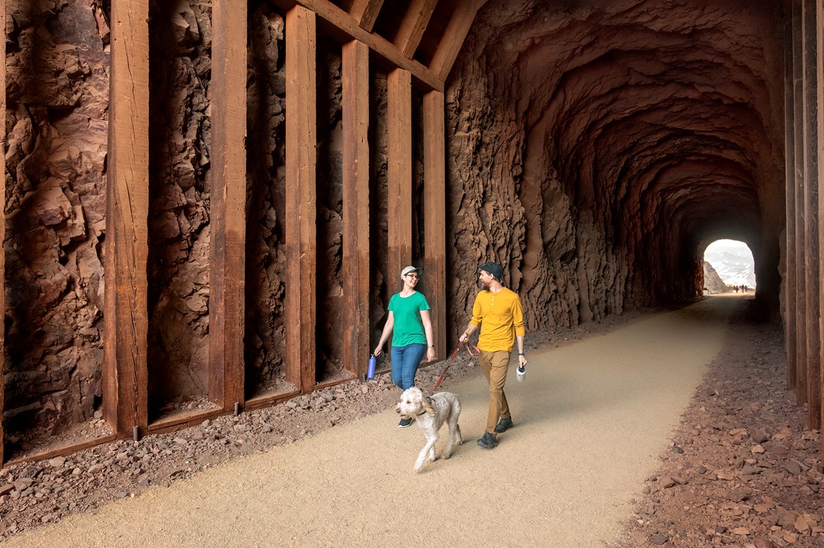 two people walking through tunnel two people walking through tunnel
