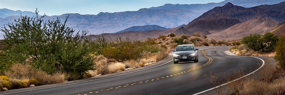 Car driving on scenic road in park Driving in Lake Mead Wilderness