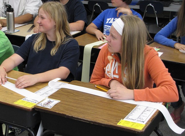 Students make a scale model of distances between planets in our solar system