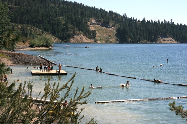 Swimmers play in water