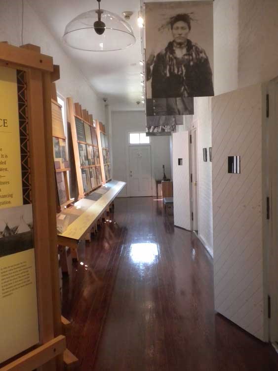 Color photo of main hallway and exhibits at the Fort Spokane Visitor Center