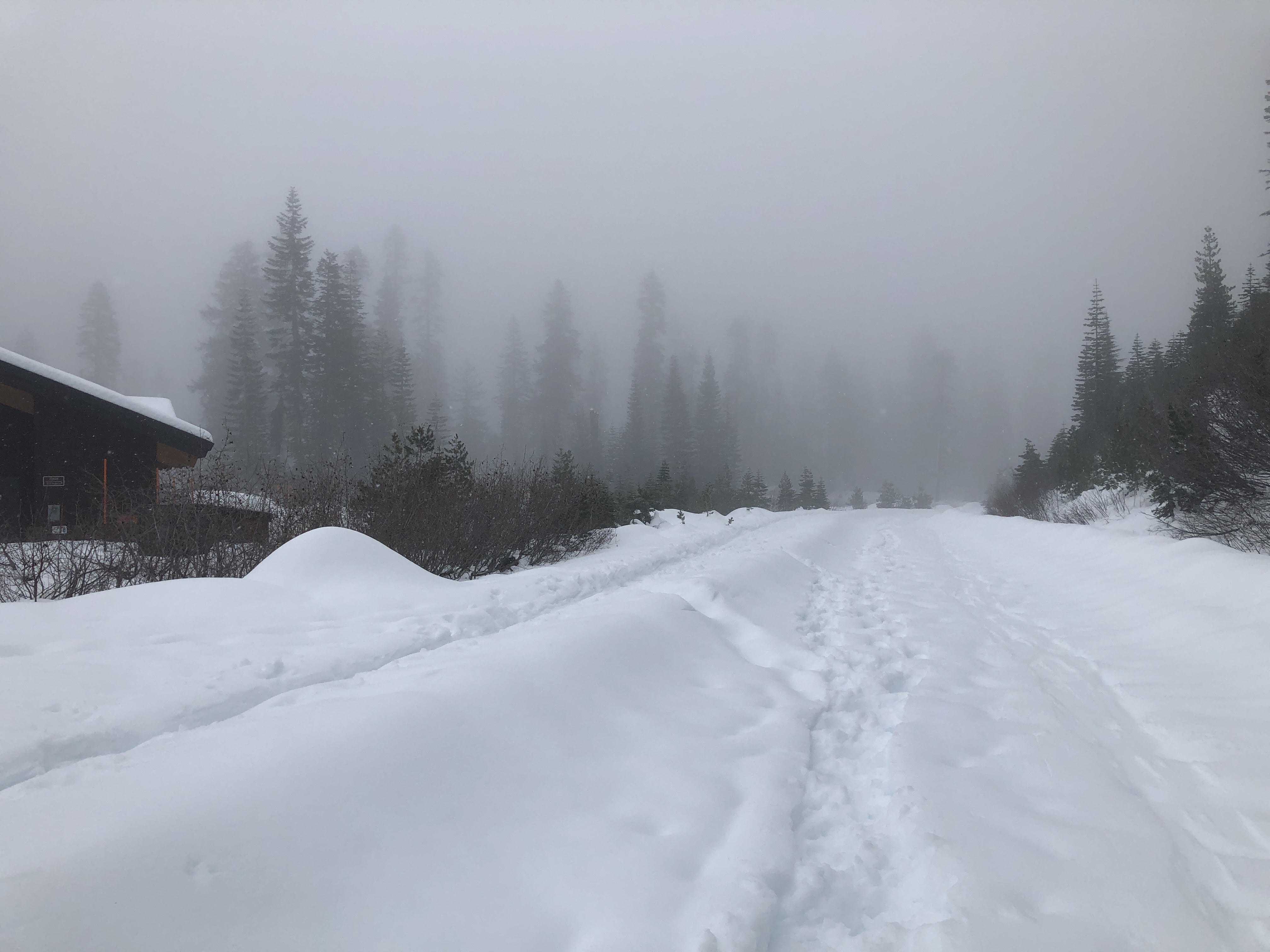 A snow-covered road seen from Kohm Yah-mah-nee Visitor Center