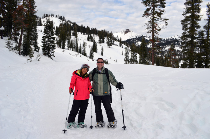 A couple snowshoeing on the park highway