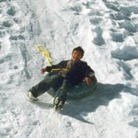 A young sledder enjoys the ride