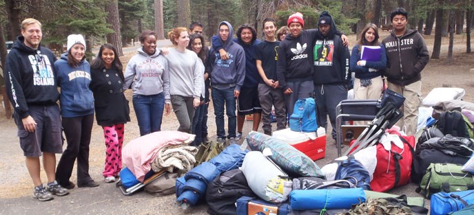 A youth camping group with their camping equipment.