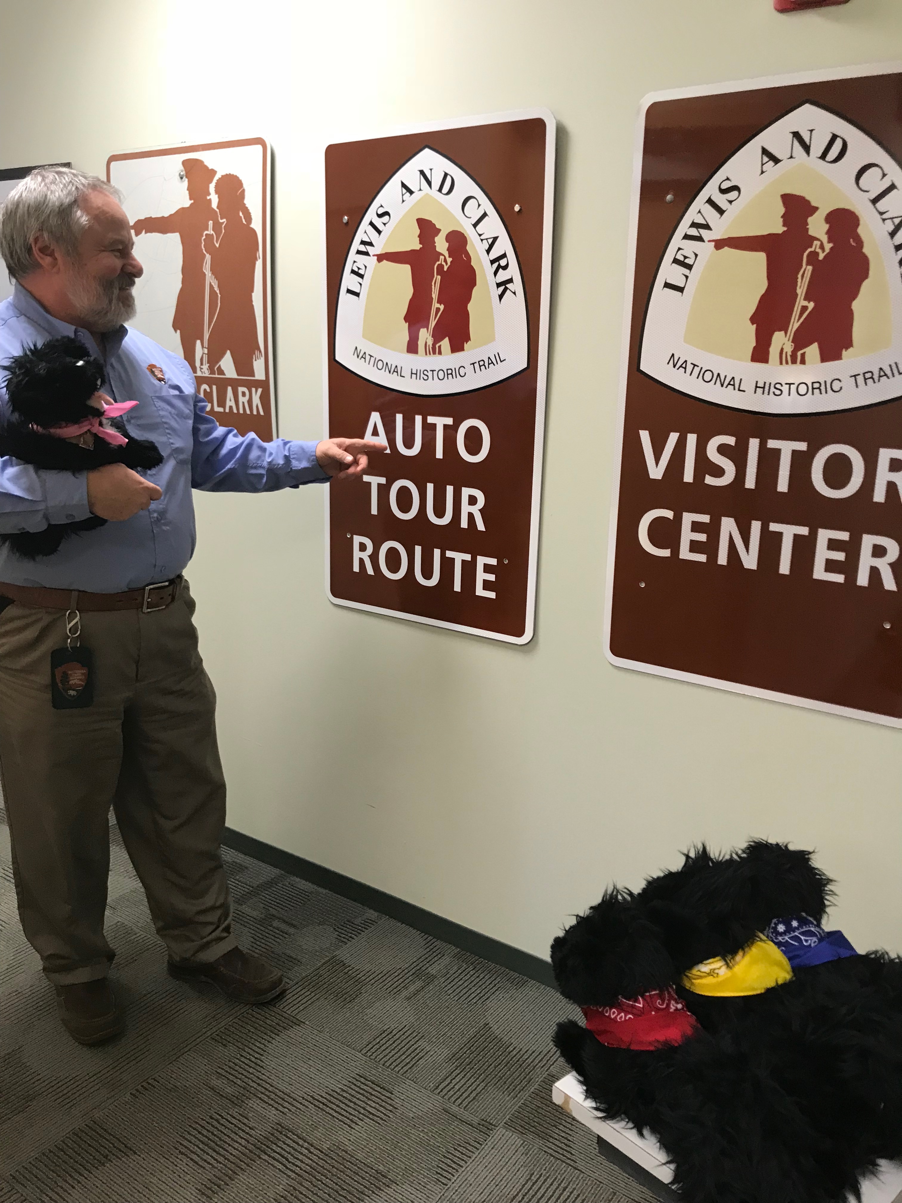 Man showing auto tour sign