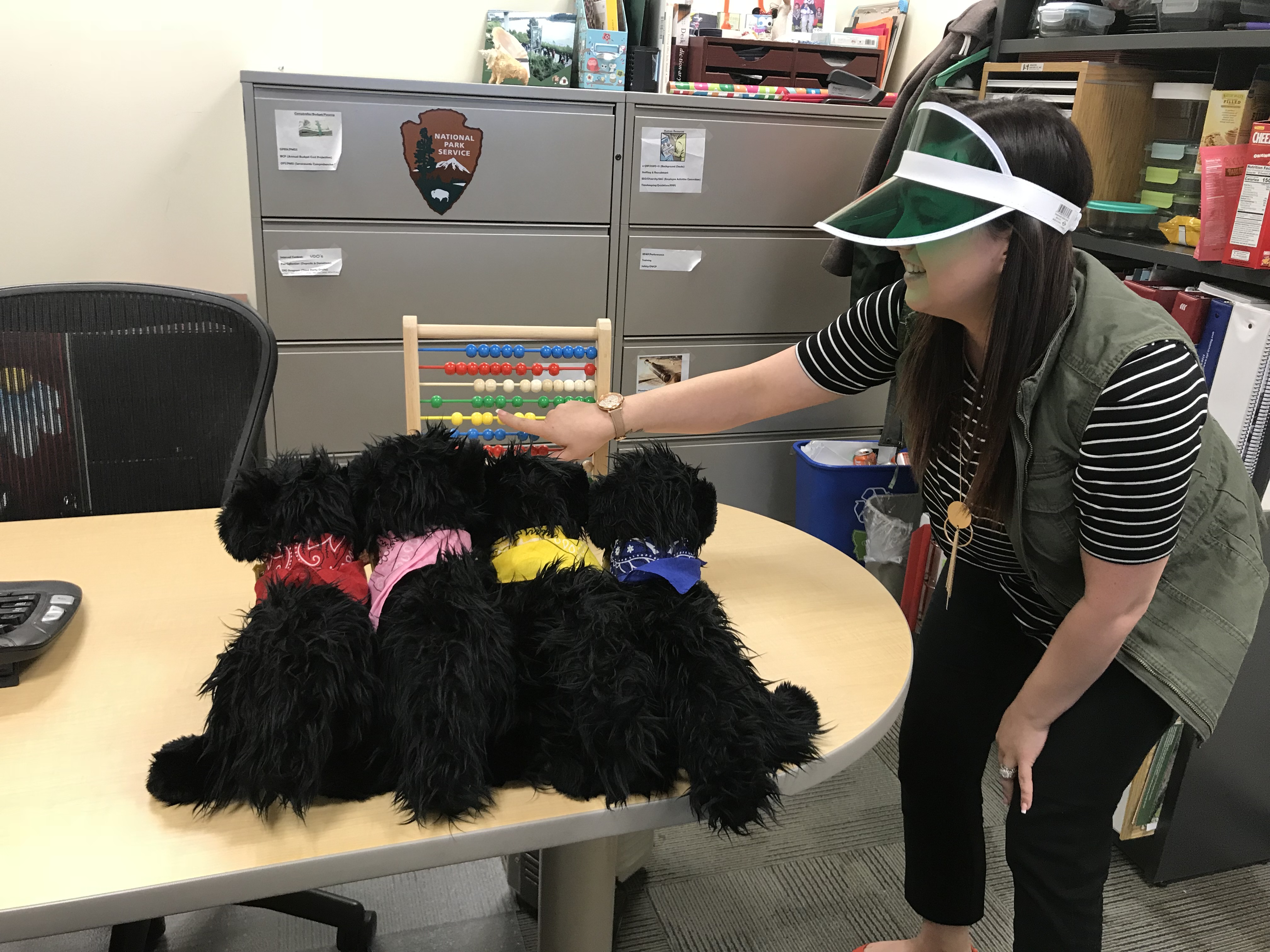 Miki shows the pups an abacus