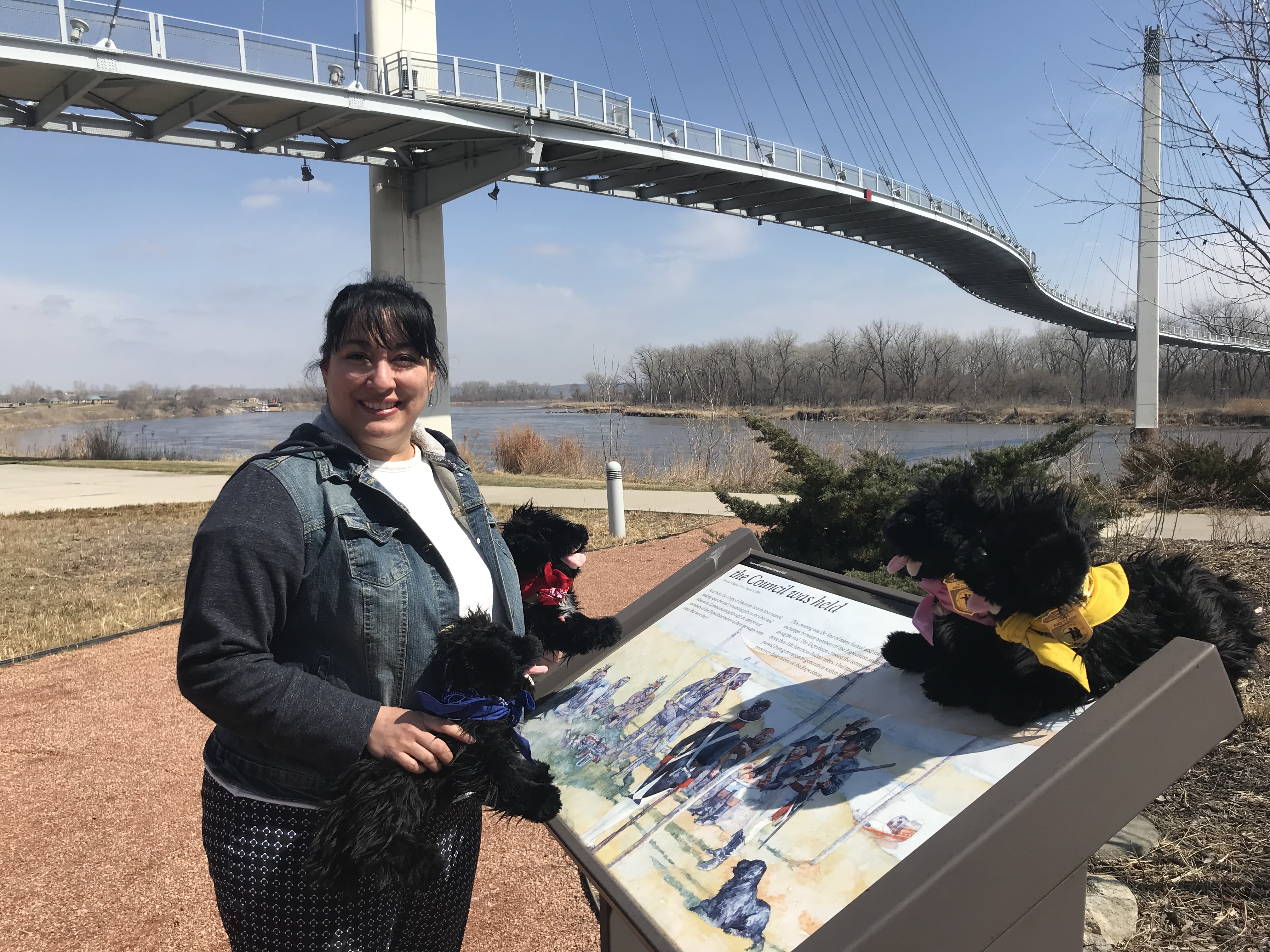 Woman standing near Missouri River at interpretive sign