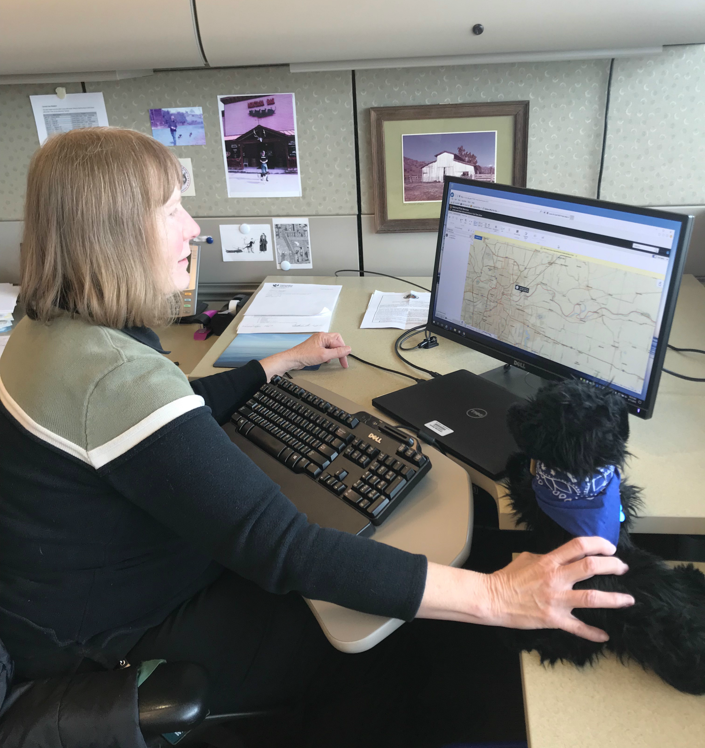 Meet Linda Helm Woman sitting at a computer