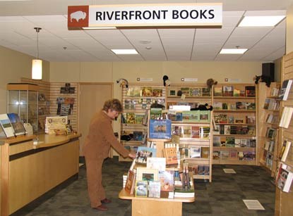 A shopper browses in Riverfront Books. A shopper browses in Riverfront Books.