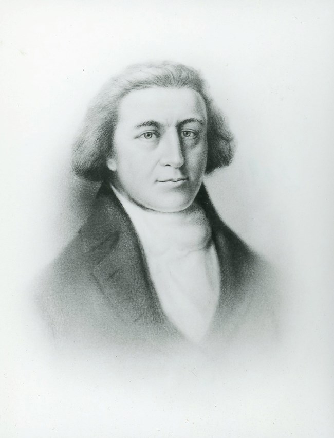 Captain Robert Gray-The Oregon Encyclopedia Portrait of middle aged man of the late 1700s upper class. His hair is pulled back below his ears. He wears a white shirt and black jacket.