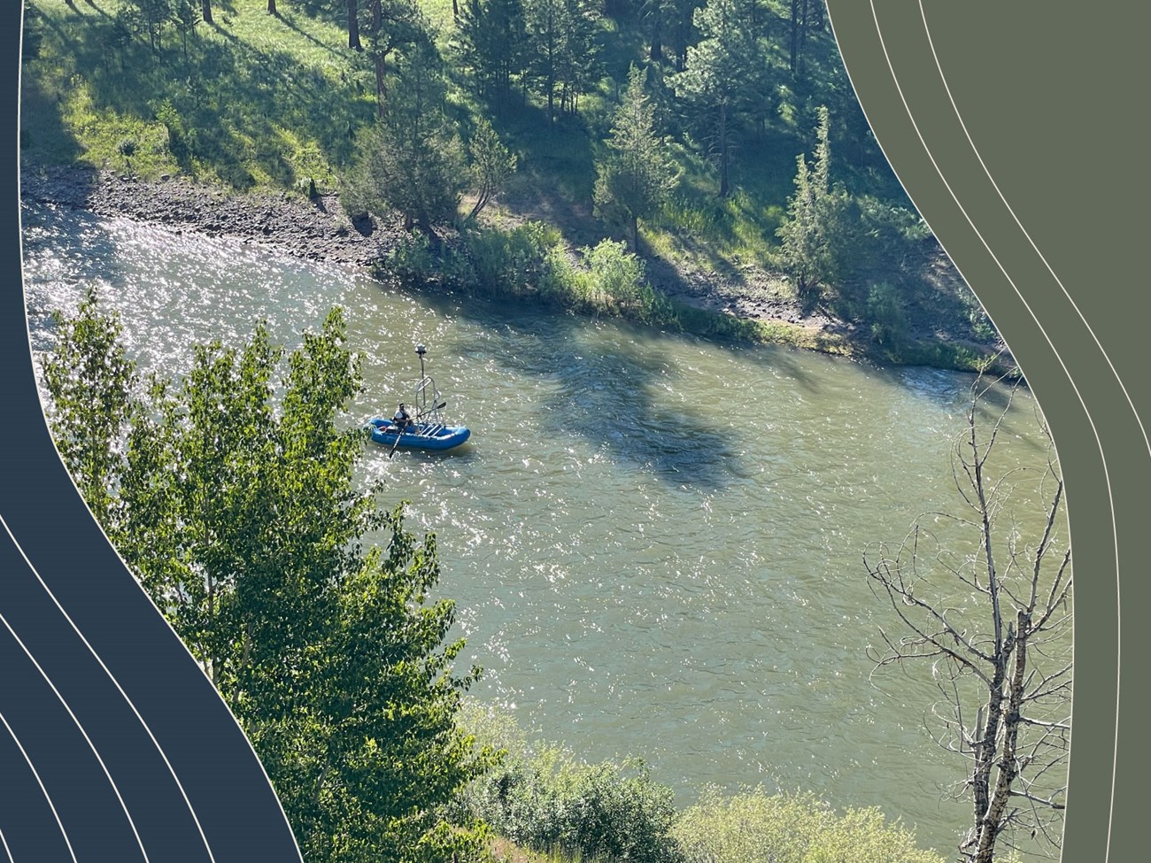 Blue rubber boat floats down tree lined river. Blue and Green curved striped design on either side.